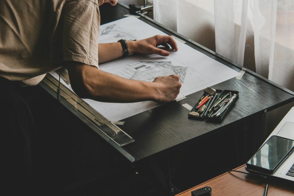 Architect Working at A Drafting Table | Pytha 3D CAD Software | Inline Consulting